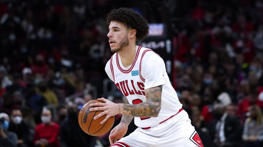 Chicago Bulls guard Lonzo Ball drives against the Detroit Pistons during the second half of an NBA basketball game in Chicago, Saturday, Oct. 23, 2021. The Bulls won 97-82. 