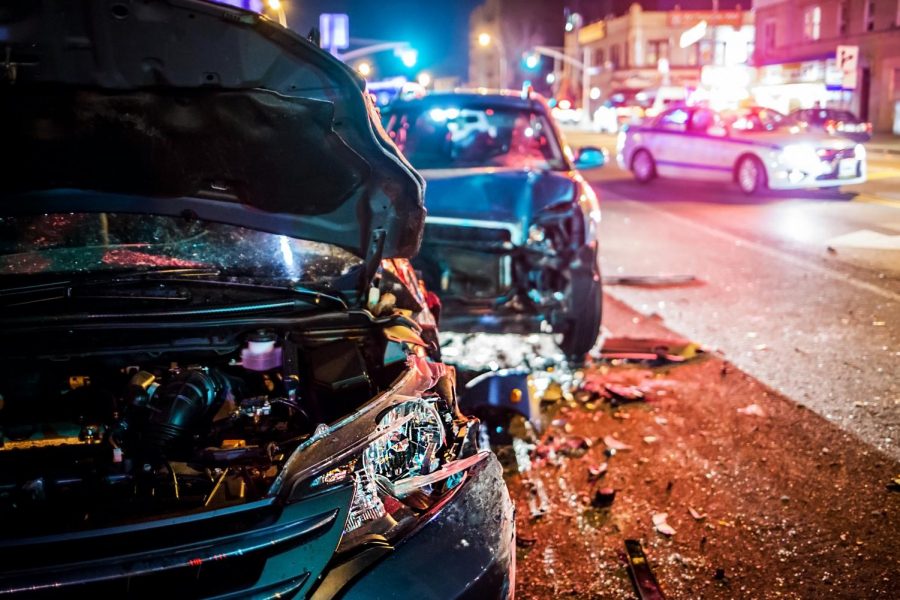 Two vehicles sit damaged after a crash.