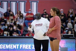 Head volleyball coach Ray Gooden coaches on his team during a Sept. 18 game against Wisconsin at Victor E. Court.