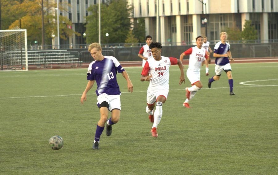 Sophomore midfielder Roland Dearborn chases down a Western Illinois defender during NIUs win over WIU on Sept. 18.