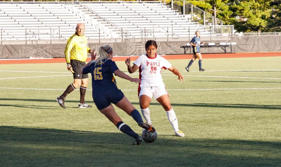 Freshman midfielder/forward Edith Delgado defends a Toledo player during NIUs match on Sept 23.