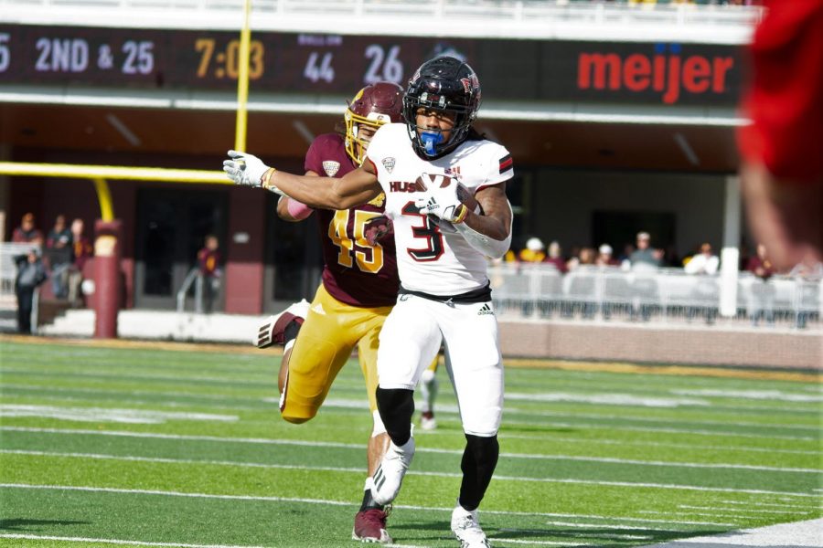 Redshirt senior wide reciever Tyrice Richie escapes a Central Michigan defender in NIUs 39-38 victory against CMU in Mount Pleasant, Michigan on Oct. 23. 