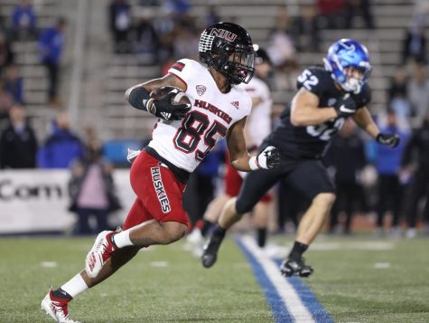Then-COVID-freshman wide reciever Trayvon Rudolph rushes past defenders on his way to a 75-yard touchdown run in NIUs 33-27 victory over Buffalo on Nov. 17. Rudolph led all NIU receivers in 2021 with 51 receptions for 892 receiving yards.