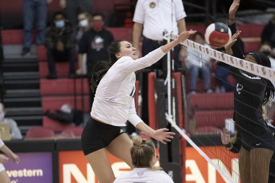 Senior middle blocker Angie Gromos spikes a ball in NIU's win on Nov. 13 against Buffalo. The victory sealed NIU a spot in the MAC tournament.