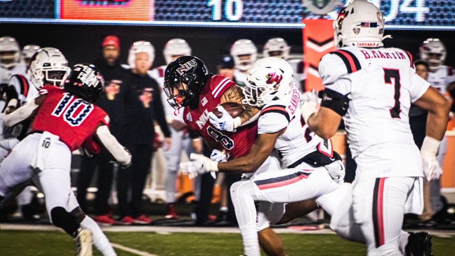 COVID-freshman running back Jay Ducker is tackled by a Ball State defender in NIUs 30-29 victory over the Cardinals on Nov. 10 at Huskie Stadium. Ducker had a touchdown run with 2:42 remaining to give NIU their first lead of the game.