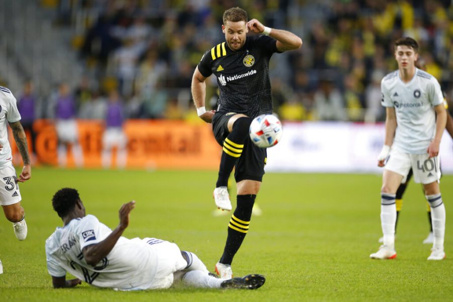 Columbus Crew's Josh Williams, front right, kicks the ball over Chicago Fire's Carlos Teran during the second half of an MLS soccer match Sunday, Nov. 7, 2021, in Columbus, Ohio. 