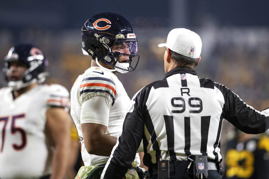 Chicago Bears quarterback Justin Fields (1) talks to Referee Tony Corrente (99) during an NFL football game, Monday, November 8, 2021 in Pittsburgh. 