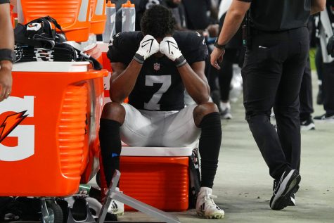 Las Vegas Raiders wide receiver Zay Jones (7) sits on the sidelines with his head in his hands during the second half of an NFL football game against the Kansas City Chiefs, Sunday, Nov. 14, 2021, in Las Vegas. 