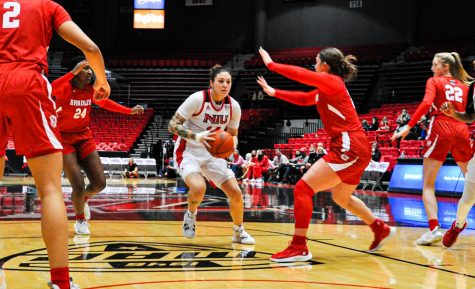 Senior forward Mikayla Brandon works her way through defenders in NIUs 80-59 victory against Bradley on Nov. 22 at the Convocation Center. Brandon finished the game with 15 points and 10 rebounds. (Wes Sanderson | Northern Star)