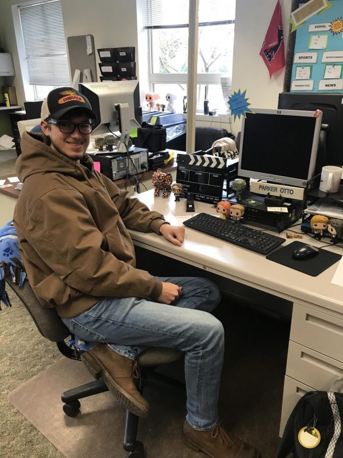 Parker Otto sits at an editors desk in the Northern Star office. During the 2019 fall and spring semesters, Parker was the Lifestyle editor.