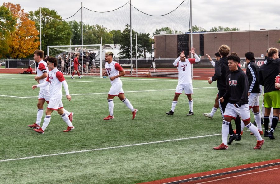 The men's soccer team celebrates a late goal in the Huskies 2-1 victory over Akron on Oct. 30 at the NIU Soccer and Track & Field Complex.