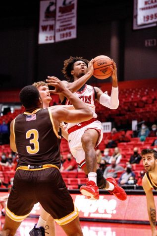 Sophomore guard Keshawn Williams goes for a layup in NIUs exhibition game against St. Francis on Oct. 30.