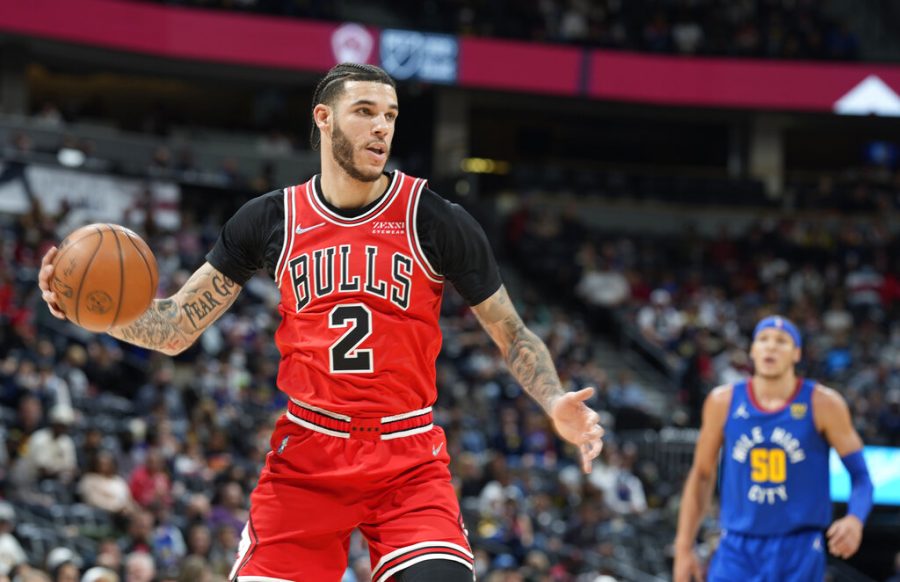 Chicago+Bulls+guard+Lonzo+Ball%2C+front%2C+pulls+in+a+rebound+as+Denver+Nuggets+forward+Aaron+Gordon+defends+in+the+first+half+of+an+NBA+basketball+game+Friday%2C+Nov.+19%2C+2021%2C+in+Denver.+