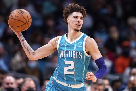 Charlotte Hornets guard LaMelo Ball passes the ball against the Minnesota Timberwolves during the first half of an NBA basketball game in Charlotte, N.C., Friday, Nov. 26, 2021. 