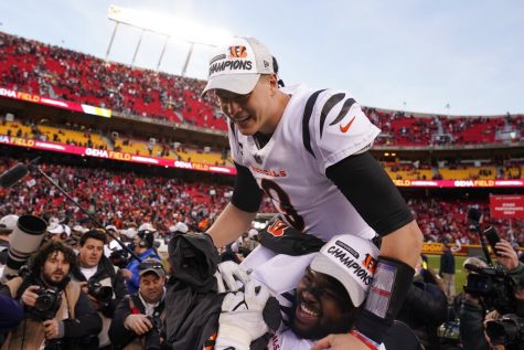 Cincinnati Bengals quarterback Joe Burrow celebrates at the end of the AFC championship NFL football game against the Kansas City Chiefs, Sunday in Kansas City, Missouri. The Bengals won 27-24 in overtime. (AP Photo/Charlie Riedel)