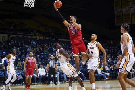 Senior guard Anthony Crump attempts a layup during Saturdays loss to the University of Toledo.