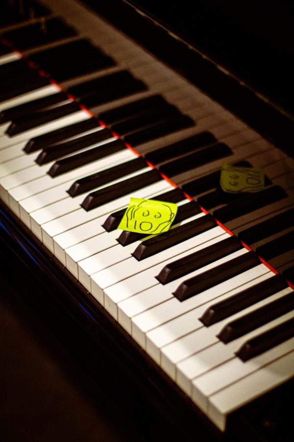 A sticky note of the The Scream painting by Pablo Picasso on the Grand Piano on the first floor of the student center.
