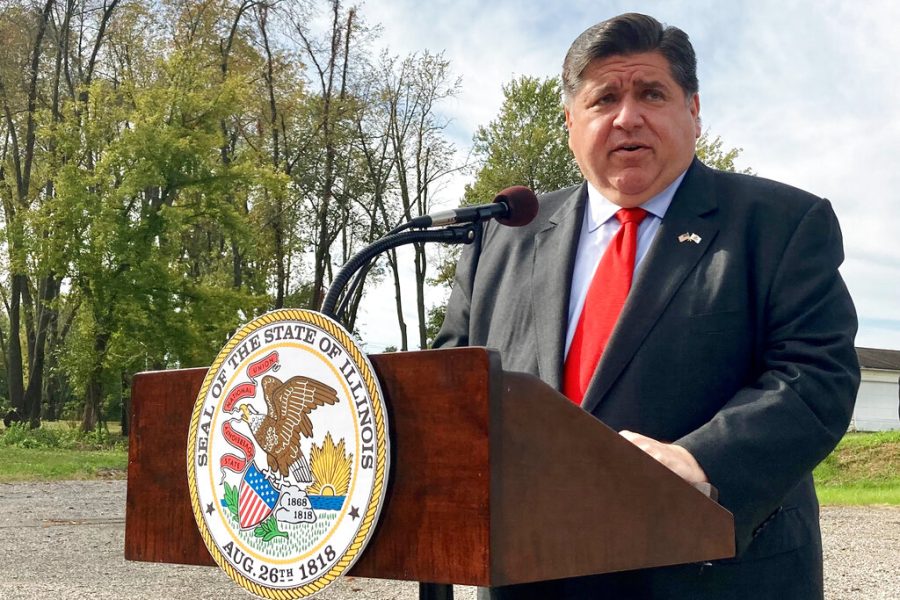 FILE - Illinois Gov. J.B. Pritzker speaks on Oct. 27, 2021, in Springfield, Ill. Pritzker laid out a freeze to the states gas and grocery taxes for FY23 in Wednesday State of the State Address in Springfield.(AP Photo/John OConnor, File)