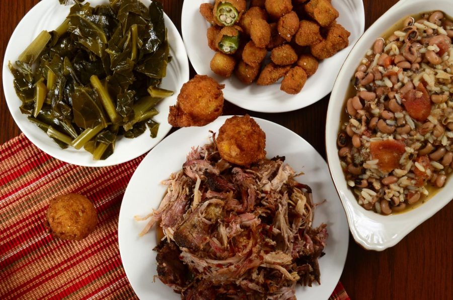 Barbecued pulled pork with collard greens, hush puppies, fried okra and hoppin john, a dish often eaten on New Years Day for good luck