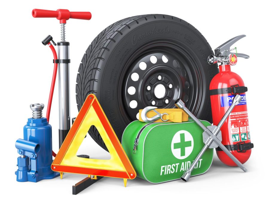 A set of automotive accessories including a spare wheel, fire extinguisher, first aid kit, emergency warning triangle, jack, tow rope, wheel wrench and pump. 