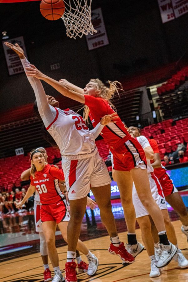 Junior forward AJah Davis attempts a layup against Ball State University freshman forward Marie Kiefer during a matchup on Jan. 5 at the Convocation Center in DeKalb. Davis recorded 12 points and 12 rebounds in the 83-82 overtime loss to the Cardinals. (Summer Fitzgerald/Northern Star)
