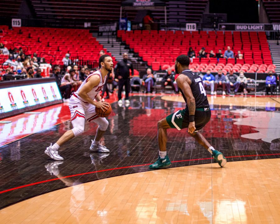 Trendon defends the ball against Bryce McBride in NIU’s 77-70 victory over Eastern Michigan on January 15.