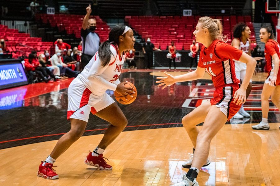 Junior forward AJah Davis plays one-on-one against Ball State freshman forward Marie Kiefer during a matchup on Jan. 5 at the Convocation Center in DeKalb. The Huskies left Muncie Saturday with a 77-72 victory, avenging their 83-82 overtime loss earlier in the season to the Cardinals. (Summer Fitzgerald | Northern Star)