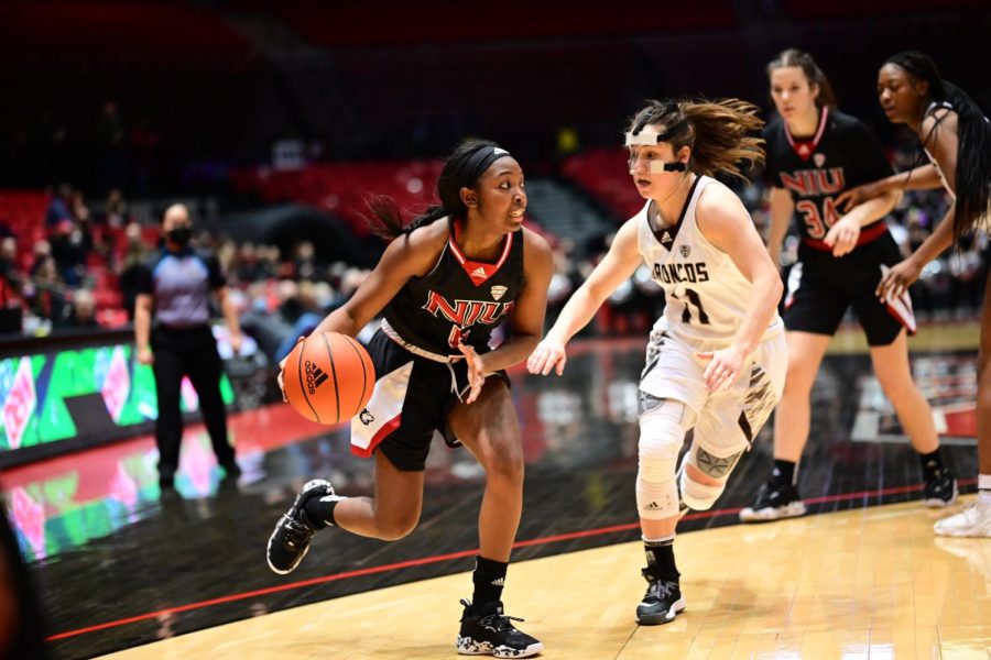 Graduate+guard+Nia+Ahart+%28left%29+advances+past+the+3-point+line+whilst+being+defended+by+Western+Michigan+sophomore+guard+Megan+Wagner+during+Saturdays+game+in+DeKalb.+The+Huskies+defeated+the+Broncos+73-55+at+the+Convocation+Center+in+DeKalb.+%28Zohair+Khan%2FNorthern+Star%29