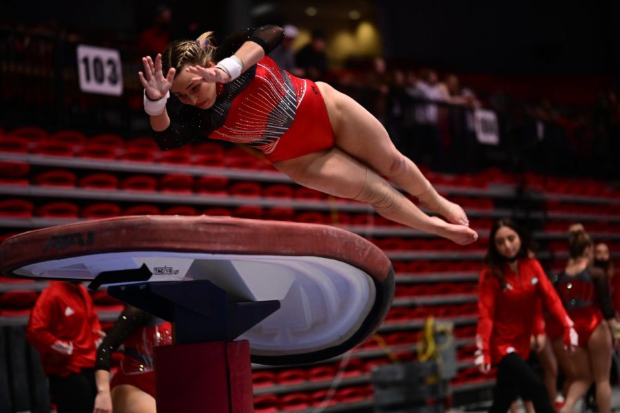 Junior Ciara Ryan prepares to engage the handspring during a vault attempt. The Huskies took third place behind Iowa 
State University and Central Michigan University at the event with a team score of 195.500.