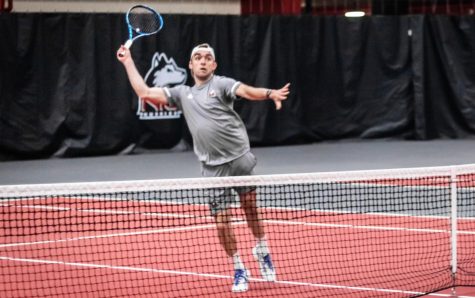 Redshirt senior Kristopher Ortega swings during a tennis match against the University of Omaha March 23 in DeKalb.