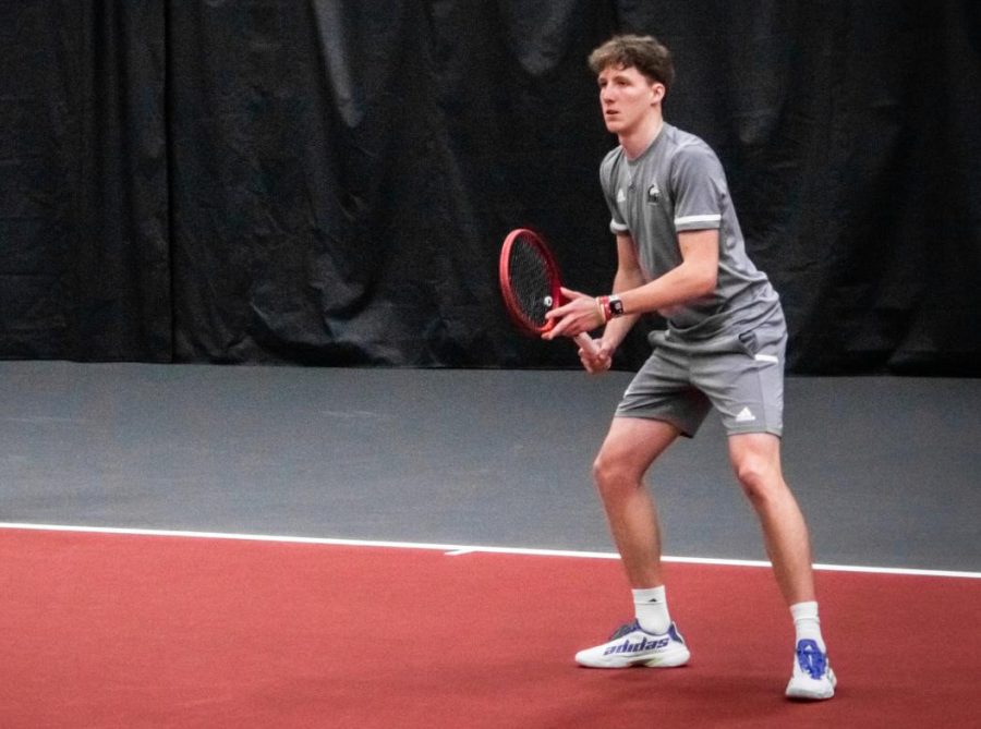 Freshman+Christopher+Knutson+plays+during+a+tennis+match+March+23.