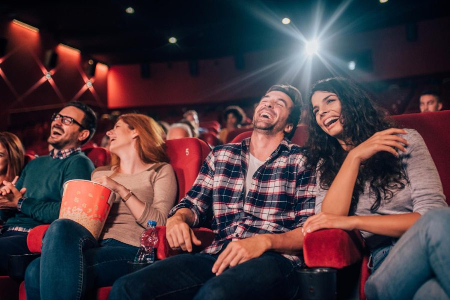 Laughing young people at cinema (Getty Images)