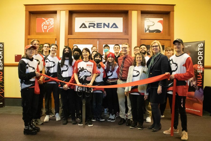 NIU President Freeman stands alongside E-Sports staff, preparing to cut the ribbon, officially unveiling the new Esports Arena in Altgeld Hall on Wednesday.