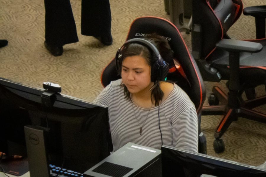 NIU Freshman Nursing student Allyson Evangelista tries the PCs in the newly unveiled Esports Arena in Altgeld Hall on Wednesday