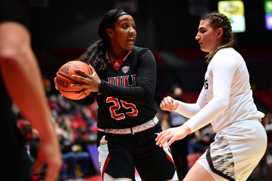 Junior+forward+AJah+Davis+%28left%29+handles+the+ball+whilst+being+defended+by+Western+Michigan+University+freshman+center+Lauren+Audino+during+a+game+on+Feb.+19+at+the+Convocation+Center+in+DeKalb.+NIU+defeated+the+Broncos+73-55+in+the+first+game+of+a+doubleheader+with+mens+basketball+as+part+of+the+Cram+the+Convo+event.+%28Zohair+Khan%2FNorthern+Star%29
