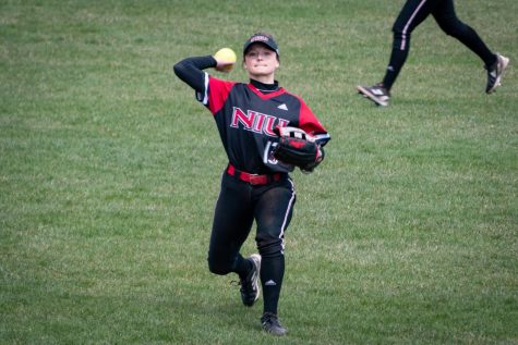 Senior utility player Mackenzie Mahy fields and throws a ball during a game against Kent State April 16 in DeKalb.