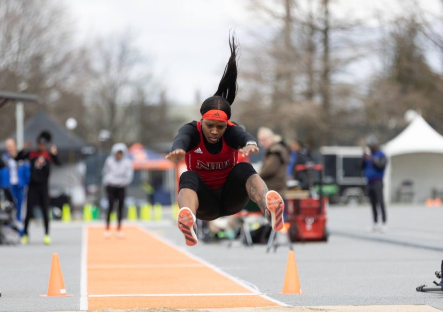 Senior athlete Jazmyn Smith jumps during an event April 9 at the Illini Classic in Urbana, Illinois.