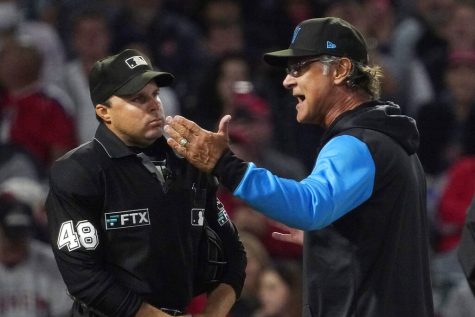 Miami Marlins manager Don Mattingly, right, argues with home plate umpire Nick Mahrley after being ejected during the fourth inning of a baseball game against the Los Angeles Angels Monday, April 11, 2022, in Anaheim, Calif. (AP Photo/Mark J. Terrill)
