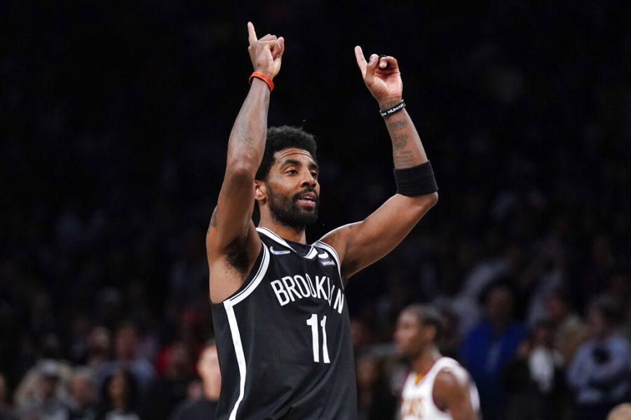 Brooklyn Nets Kyrie Irving reacts after sinking a basket during the second half of the opening basketball game of the NBA play-in tournament against the Cleveland Cavaliers, Tuesday, April 12, 2022, in New York. 
