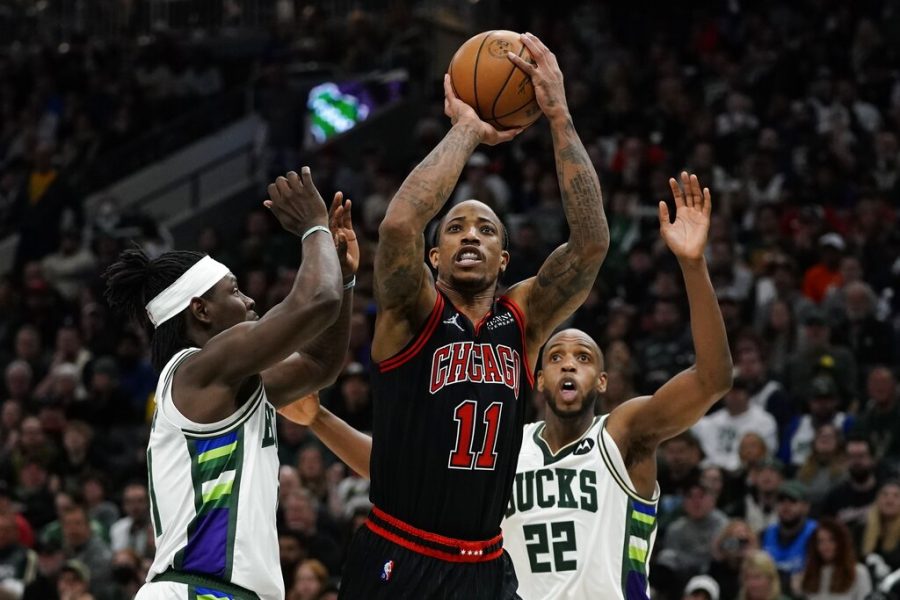 Chicago Bulls DeMar DeRozan shoots past Milwaukee Bucks Jrue Holiday during the second half of Game 1 of their first round NBA playoff basketball game April 17 in Milwaukee. (AP Photo/Morry Gash)