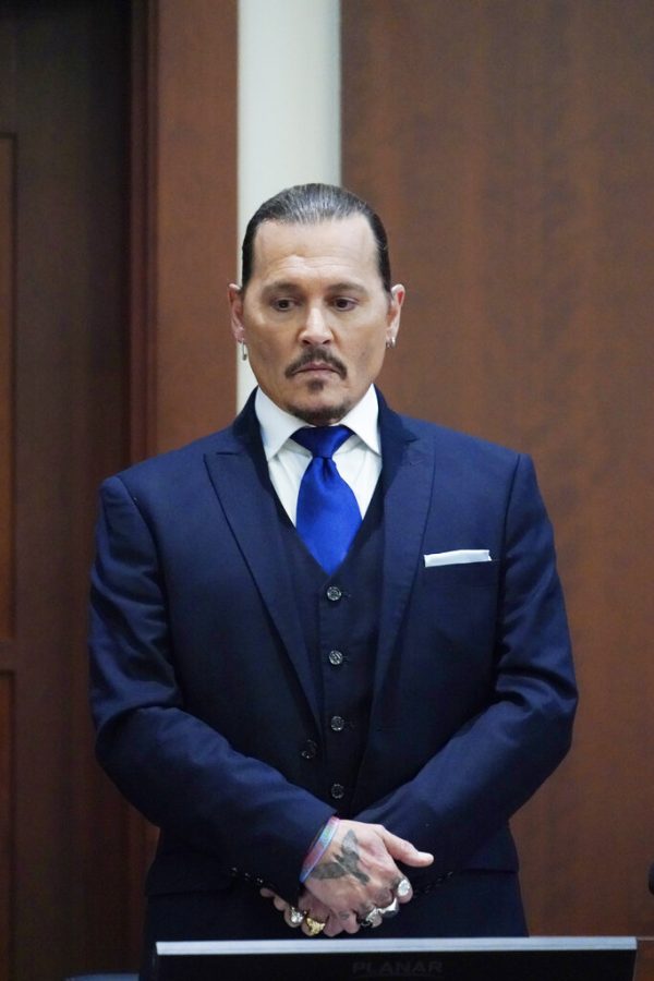 Actor+Johnny+Depp+stands+in+the+courtroom+after+a+break+at+the+Fairfax+County+Circuit+Courthouse+in+Fairfax%2C+Va.%2C+Monday%2C+April+25%2C+2022.+Depp+sued+his+ex-wife+Amber+Heard+for+libel+in+Fairfax+County+Circuit+Court+after+she+wrote+an+op-ed+piece+in+The+Washington+Post+in+2018+referring+to+herself+as+a+public+figure+representing+domestic+abuse.+