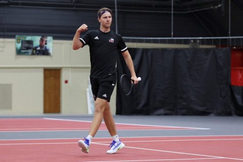 Junior tennis player Oliver Valentinsson celebrates during a match against Binghamton University April 1 in DeKalb.