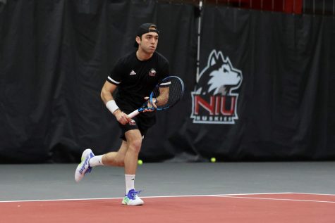 Redshirt senior tennis player Kristopher Ortega runs during a match against Binghamton University April 1 in DeKalb.