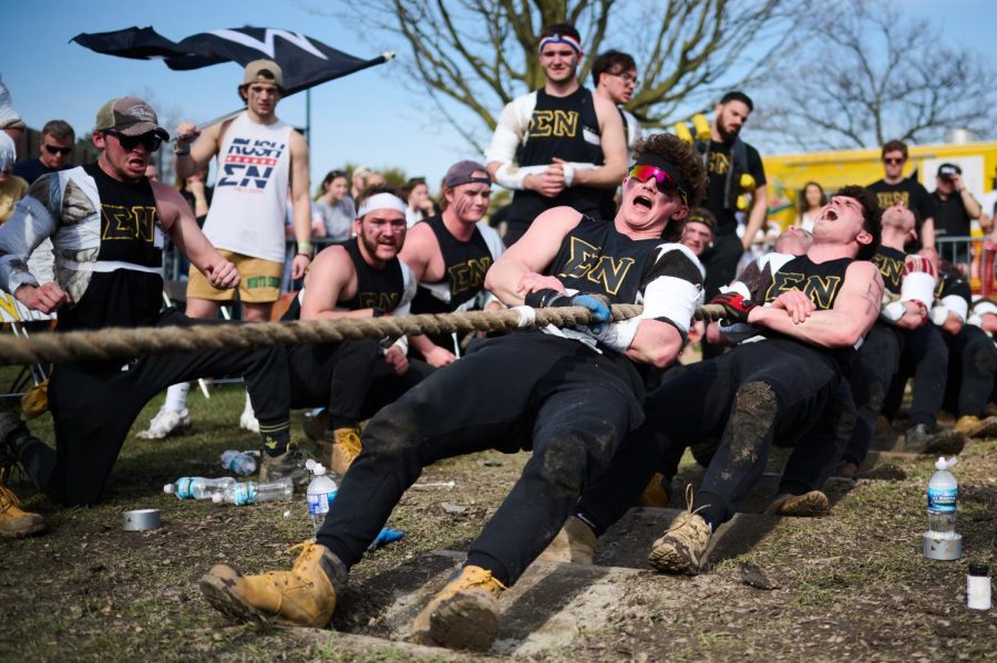 Sigma Nu second rope tuggers secure the white center marker on the rope during their tug-of-war match against Phi Sigma Kappa on Saturday.