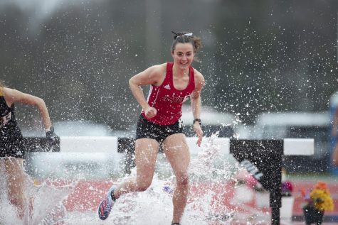 Senior distance runner Grace Louis races in the 3,000-meter steeplechase at the Redbird Invite on April 2 in Normal, Illinois. Louis recorded her highest finish at the event after crossing the finish line in 11:40.02 to claim second place. (Courtesy of NIU Athletics)