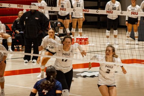 (Left to right) Ella Mihacevich, Sammi Lockwood and Katie Jablonski positioning to receive a spike from NJIT during the first set of the team’s match on Friday.  (Sean Reed | Northern Star)