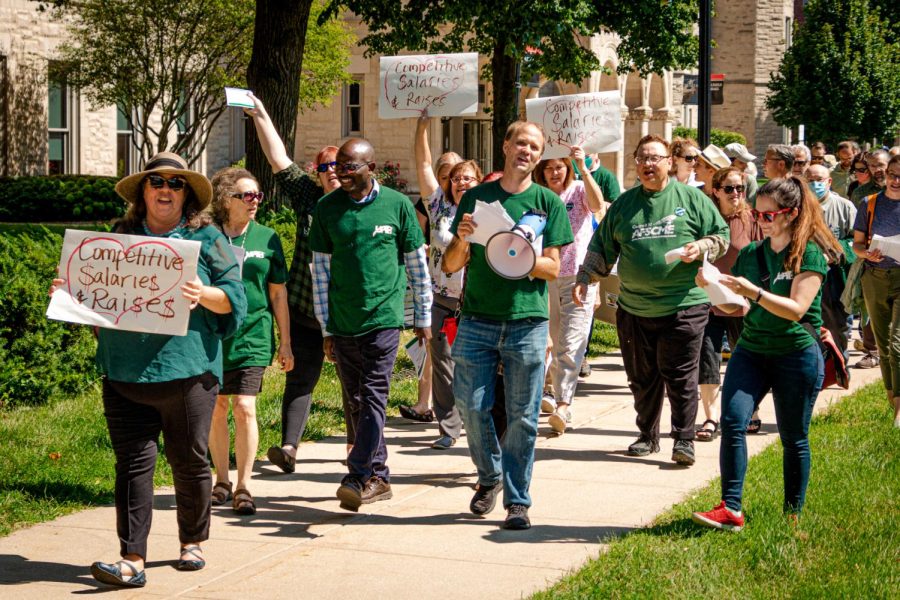 NIU Faculty members marching from Altgeld Hall to Founders Memorial Library Thursday Sept. 8. This was the third protest organized by faculty members in the past year, all with the goal of securing more equitable contracts for NIU faculty. (Mingda Wu | Northern Star).