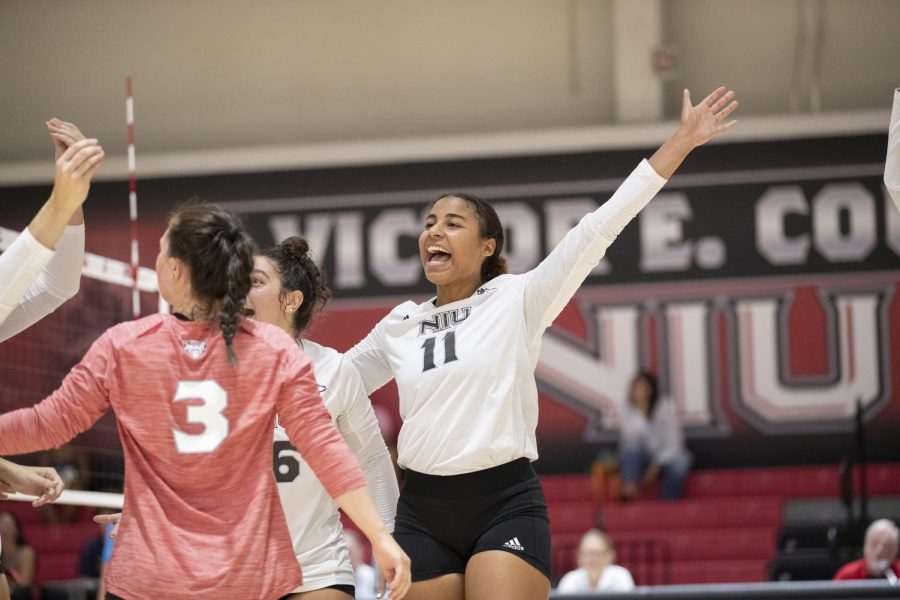 Sophomore middle blocker Charli Atiemo celebrates between rallies during an exhibition match against the University of Northern Iowa on Aug. 20. Atiemo was NIUs co-leader in kills (11) against the UMKC Roos Friday.