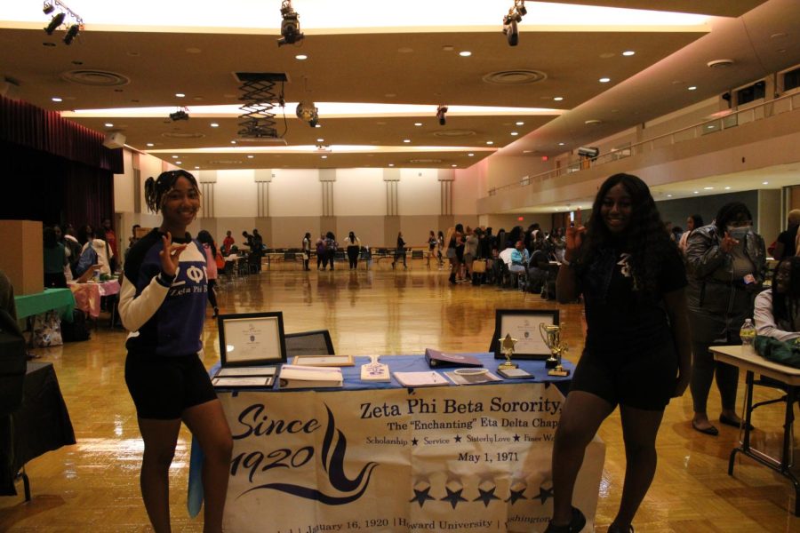 Seniors Courtney Hollis (left) and Ladesa Jeffries (right) host a table for Zeta Phi Beta Sorority, Inc. at the CBS open house. (Nyla Owens | Northern Star)