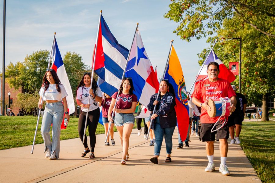 On Sept. 20, 2022, students and community members carrying the Chilean, Cuban, Panamanian, Ecuadorian and Paraguayan flags as they parade through MLK Commons in celebration of the beginning of Latino Heritage Month. (Mingda Wu | Northern Star)
